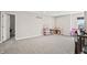 Bright and airy bonus room featuring neutral walls, plush carpeting, and a versatile layout for various activities at 6472 W Treeline Ln, McCordsville, IN 46055