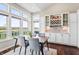 Dining room with views of the lake, a wine rack, and a table with chairs at 6472 W Treeline Ln, McCordsville, IN 46055