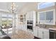 Kitchen featuring a marble island, pendant lighting, white cabinets, and stainless appliances at 6472 W Treeline Ln, McCordsville, IN 46055
