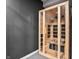 Modern light wood sauna with glass door in home gym offers relaxation at 6472 W Treeline Ln, McCordsville, IN 46055