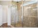 Contemporary shower featuring a glass enclosure and rainfall shower head at 6472 W Treeline Ln, McCordsville, IN 46055