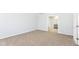 Spacious carpeted bedroom with a doorway to an ensuite bath at 718 Marie Ln, Fortville, IN 46040