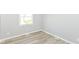 Bright bedroom with hardwood floors and neutral paint, perfect for relaxing at 718 Marie Ln, Fortville, IN 46040