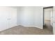 Bedroom featuring carpeted floors and double closet at 718 Marie Ln, Fortville, IN 46040