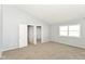 Bedroom features neutral color palette, carpet floors and natural light from the window at 718 Marie Ln, Fortville, IN 46040
