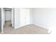 The simple bedroom features neutral walls and carpet, and ample closet space for storage at 718 Marie Ln, Fortville, IN 46040