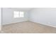 Comfortable carpeted bedroom with a bright window providing plenty of natural light at 718 Marie Ln, Fortville, IN 46040