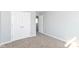This spacious bedroom features neutral colored carpet, paint, trim and a closet for ample storage space at 718 Marie Ln, Fortville, IN 46040