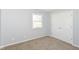 Cozy bedroom featuring carpet floors, ample natural light, and double closet at 718 Marie Ln, Fortville, IN 46040