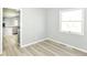 Bright living room view to open kitchen with granite countertops and wood floors at 718 Marie Ln, Fortville, IN 46040