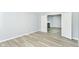 Cozy living space features fresh gray paint, wood floors, white trim, and a charming gas fireplace at 718 Marie Ln, Fortville, IN 46040