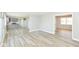 Bright, open floor plan featuring wood floors with views of the kitchen and backyard at 718 Marie Ln, Fortville, IN 46040