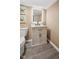 Cozy bathroom features a lighted mirror, a neutral vanity, and a luxury vinyl plank floor at 7482 N Maple Dr, Frankton, IN 46044