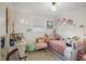 Whimsical bedroom featuring a twin bed, floral wallpaper, and a playful decor at 7482 N Maple Dr, Frankton, IN 46044