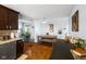 Open concept kitchen and dining area with stainless steel appliances and hardwood floors at 7482 N Maple Dr, Frankton, IN 46044