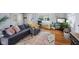 Relaxing living room with a sectional sofa, hardwood floors, and a light gray color scheme at 7482 N Maple Dr, Frankton, IN 46044