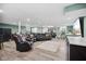 Finished basement living room with a comfy seating area, recessed lighting, and light laminate floors throughout at 7482 N Maple Dr, Frankton, IN 46044