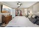 Comfortable main bedroom with a ceiling fan, TV, and neutral decor provides a relaxing retreat at 7482 N Maple Dr, Frankton, IN 46044
