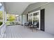 Inviting front porch featuring a cozy seating area, perfect for enjoying the outdoors at 7709 Lewis Rd, Indianapolis, IN 46256