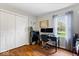 Functional home office with dual monitors, a spacious desk, and ample storage, perfect for a productive work environment at 7709 Lewis Rd, Indianapolis, IN 46256