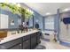 Well-lit bathroom with a double vanity, soaking tub, and separate shower stall at 8158 Wheatfield Ct, Camby, IN 46113