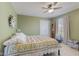 Comfortable bedroom with a double bed, ceiling fan, and natural light from the window at 8158 Wheatfield Ct, Camby, IN 46113