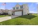 Two story home with vinyl siding, attached garage, concrete driveway, and well maintained lawn at 8158 Wheatfield Ct, Camby, IN 46113