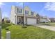 Two story home featuring brick and vinyl siding, an attached two car garage and a manicured lawn at 8158 Wheatfield Ct, Camby, IN 46113