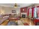Comfortable living room with hardwood floors, fireplace, and large sectional sofa at 8158 Wheatfield Ct, Camby, IN 46113