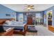 Spacious main bedroom featuring a wooden bed frame, large dresser, and natural light at 8158 Wheatfield Ct, Camby, IN 46113