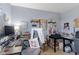 Well-equipped office featuring monitors, organized shelves, and a comfortable work area at 8158 Wheatfield Ct, Camby, IN 46113