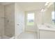 Modern bathroom with a double sink vanity, a shower and light tile at 827 Allandale Ave, Westfield, IN 46074