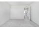 This bright bedroom boasts neutral carpet, neutral walls, and a door to the hallway at 827 Allandale Ave, Westfield, IN 46074