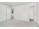 This bedroom features neutral carpet, neutral walls, and access to the closet and hallway at 827 Allandale Ave, Westfield, IN 46074