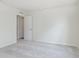 A carpeted bedroom showcases neutral walls and white doors, offering a blank canvas ready for personalization at 827 Allandale Ave, Westfield, IN 46074