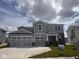 Beautiful two-story home with a two car garage, neutral siding, and brick accents at 827 Allandale Ave, Westfield, IN 46074