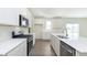Modern kitchen featuring stainless steel appliances, bright cabinets, and hard wood floors at 827 Allandale Ave, Westfield, IN 46074