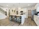 Bright kitchen features a large island with seating, stainless steel appliances, and modern pendant lighting at 827 Allandale Ave, Westfield, IN 46074