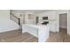 Modern kitchen featuring a central island with quartz countertops and stainless steel appliances at 827 Allandale Ave, Westfield, IN 46074