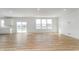 Bright, open living room with wood floors, sliding glass doors, and lots of natural light at 827 Allandale Ave, Westfield, IN 46074