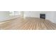 Cozy living room featuring wood floors, a modern fireplace, and ample natural light from the windows at 827 Allandale Ave, Westfield, IN 46074