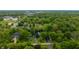 Beautiful aerial shot of home nestled on lush lot; also includes approximate property lines at 8535 Washington Blvd, Indianapolis, IN 46240