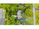Overhead view of estate shows pool, long driveway, beautiful landscaping, and ample parking at 8535 Washington Blvd, Indianapolis, IN 46240