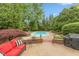 This backyard features an in-ground pool and patio seating at 8535 Washington Blvd, Indianapolis, IN 46240