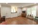 Bonus room with wood floors, built-in storage, and windows at 8535 Washington Blvd, Indianapolis, IN 46240