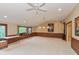 Large bonus room with wood paneling, wall decor and plenty of natural light at 8535 Washington Blvd, Indianapolis, IN 46240