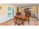 Formal dining room with hardwood floors, a chandelier, and seating for eight at 8535 Washington Blvd, Indianapolis, IN 46240