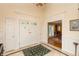 Inviting foyer with marble floors, a decorative rug, and elegant doors at 8535 Washington Blvd, Indianapolis, IN 46240