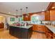 Well-lit kitchen featuring granite counters, stainless appliances, and hardwood flooring at 8535 Washington Blvd, Indianapolis, IN 46240