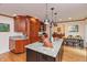 Spacious kitchen area with granite countertops, custom cabinetry, and hardwood floors at 8535 Washington Blvd, Indianapolis, IN 46240